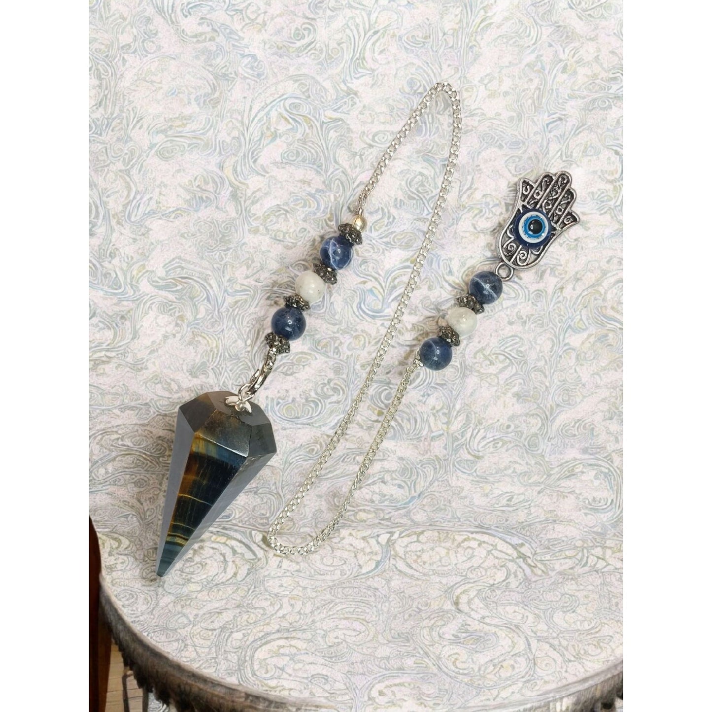 Blue Tiger Eye Pendulum with Fatima Hand & Evil Eye – Hexagonal Crystal Divination Tool