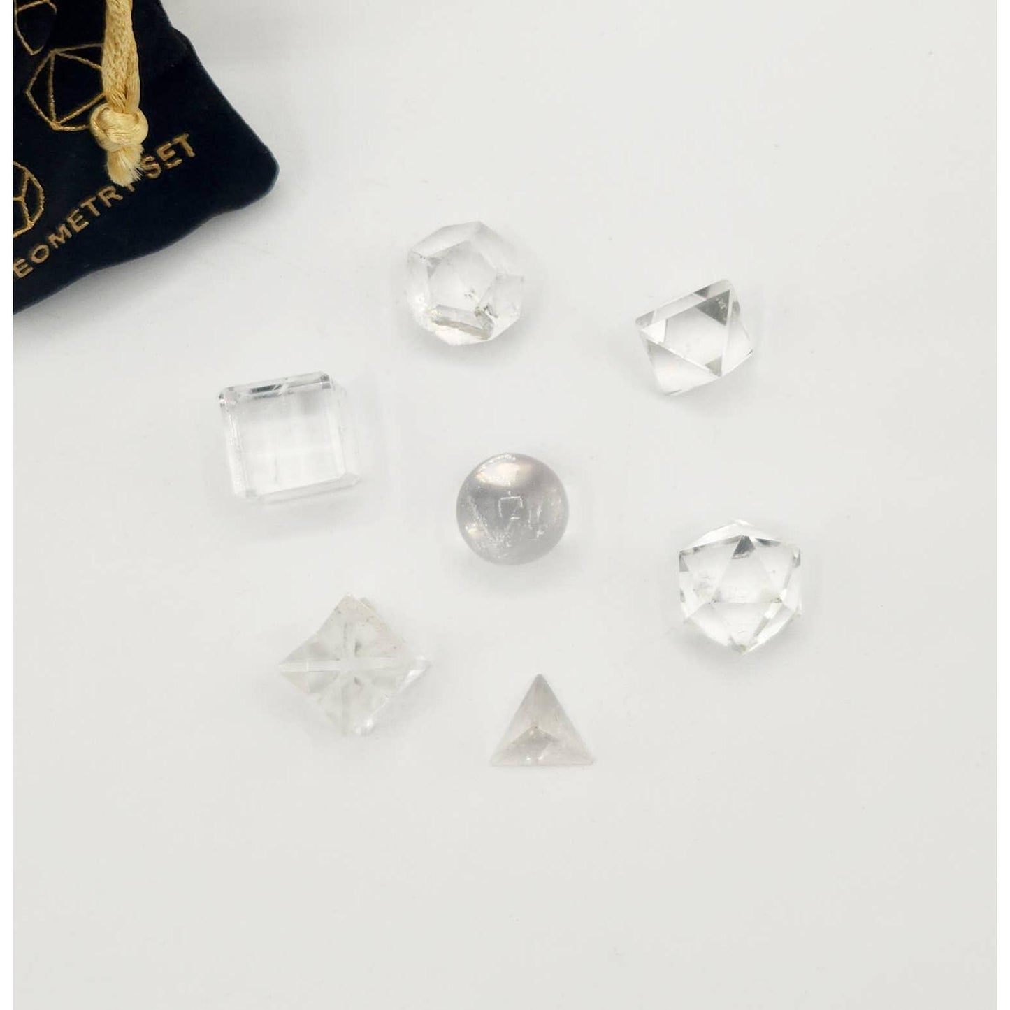 Clear Quartz Sacred Geometry Set – 7 Carved Crystals + Merkaba & Sphere with Grid & Pouch